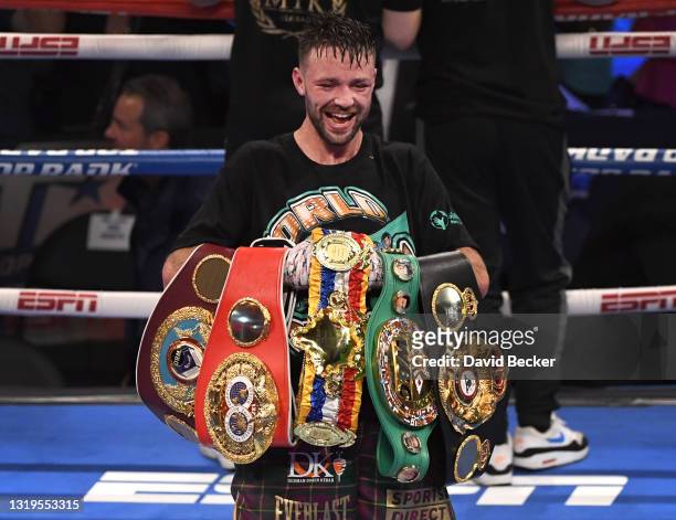 Josh Taylor poses with his title belts after his win by unanimous decision over Jose Ramirez in their junior welterweight world unification title...