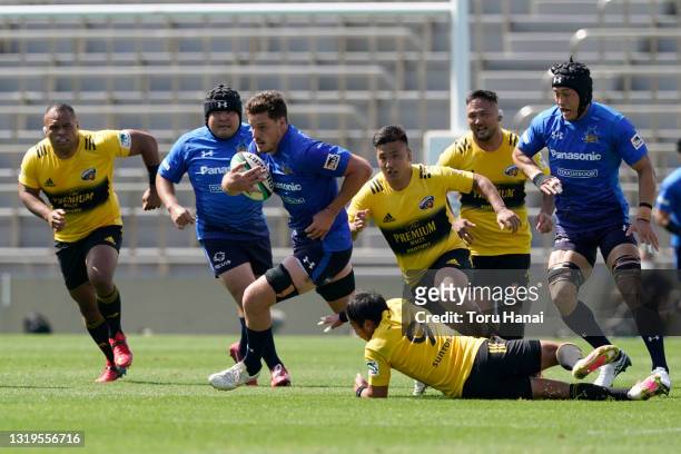 Jack Cornelsen of Panasonic Wild Knights is tackled by Yutaka Nagare of the Suntory Sungoliath during the Top League Playoff & Japan Rugby...