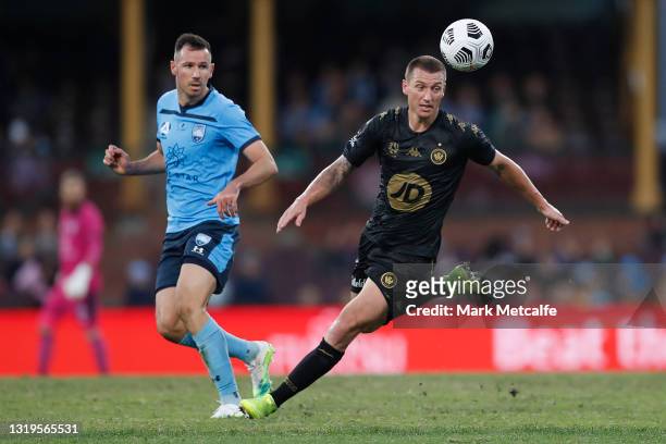 Ryan McGowan of Sydney FC and Mitch Duke of the Wanderers compete for the ball during the A-League match between Sydney FC and Western Sydney...