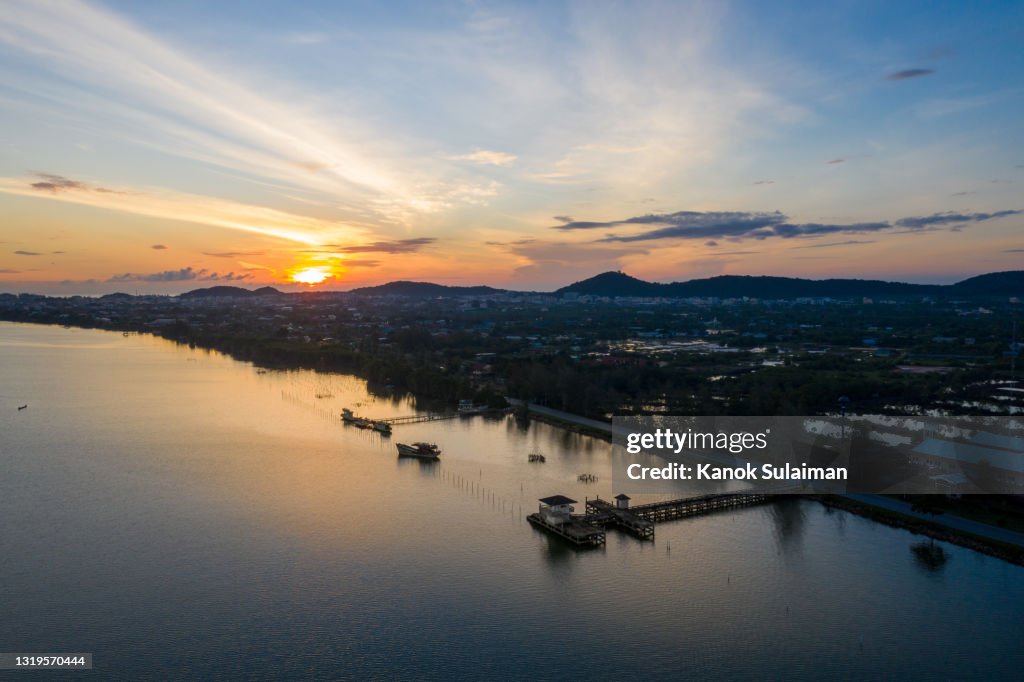 Drone flying over Songkhla lake in South of Thailand with sunrise