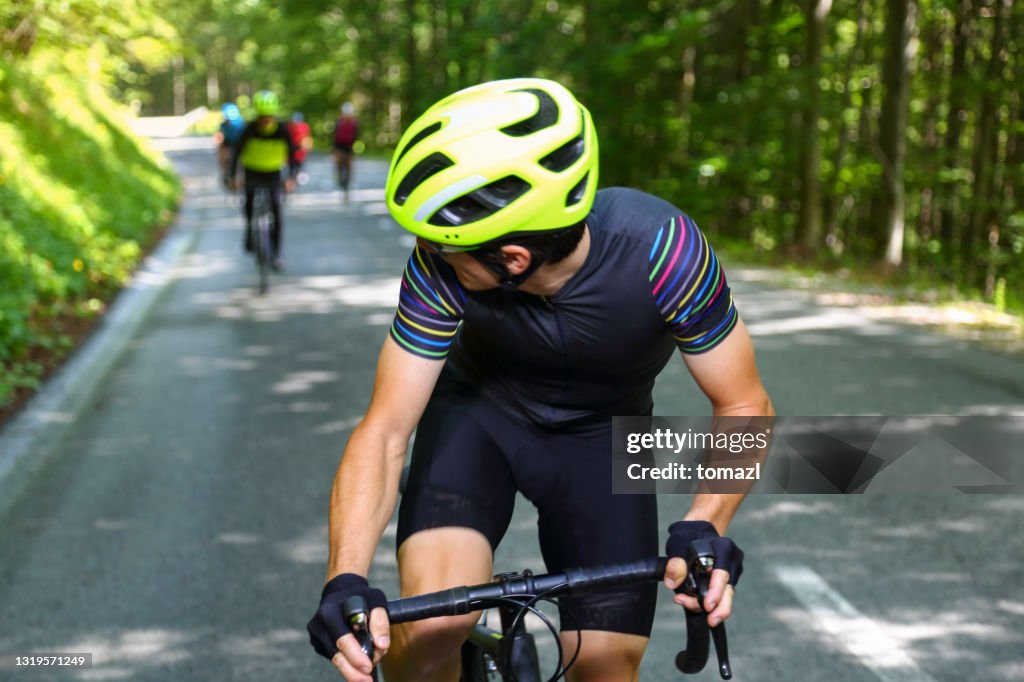 Bicycle rider in front of his friends