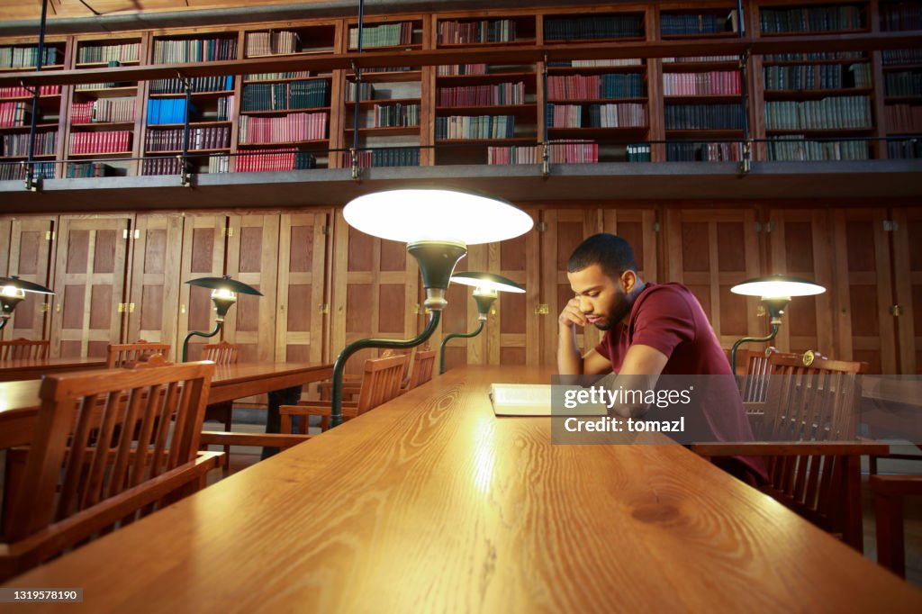 Guy In Library Man Alone In Library Reading Room High-Res Stock Photo - Getty Images