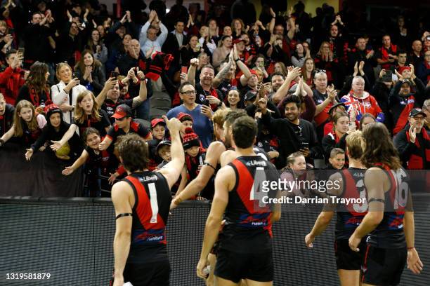 Essendon players acknowledges their fans after the round 10 AFL match between the Essendon Bombers and the North Melbourne Kangaroos at Marvel...