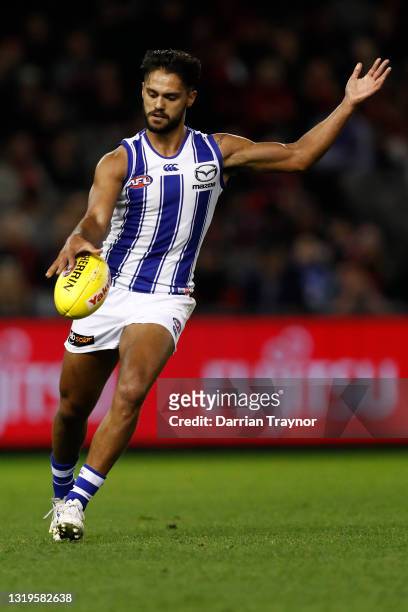 Aaron Hall of the Kangaroos kicks the ball during the round 10 AFL match between the Essendon Bombers and the North Melbourne Kangaroos at Marvel...
