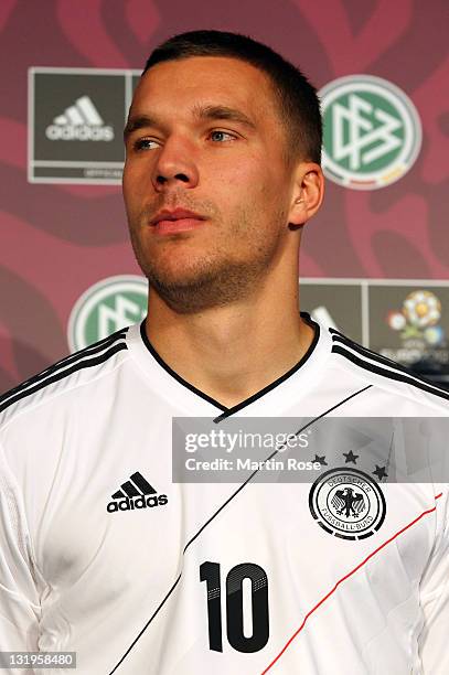 Lukas Podolski poses with his Jersey during the Germany national team Euro 2012 jersey launch at Mercedes Benz Center on November 9, 2011 in Hamburg,...