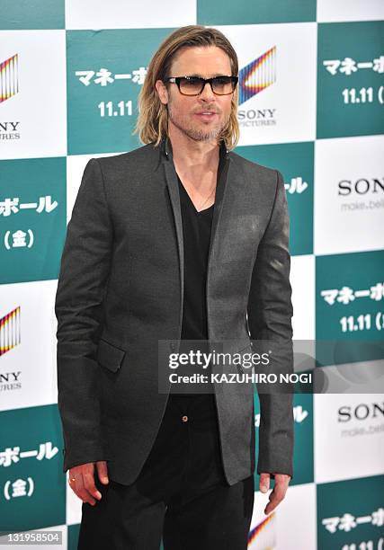 Actor Brad Pitt poses for photographers prior to the Japan premiere of his latest film "Moneyball' in Tokyo on November 9, 2011. The film will tour...