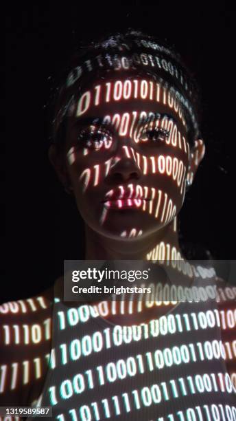 binary digits on a woman's face - woman projection face stock pictures, royalty-free photos & images