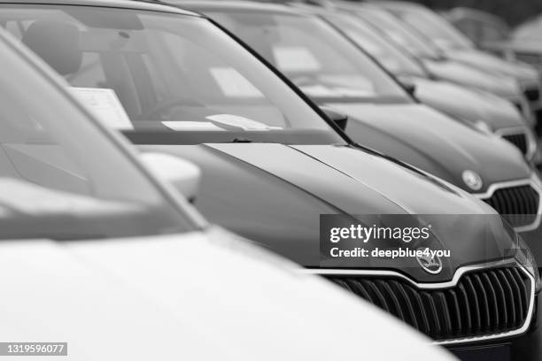 skoda superb cars parked at a public car dealership in hamburg, germany - skoda auto stock pictures, royalty-free photos & images