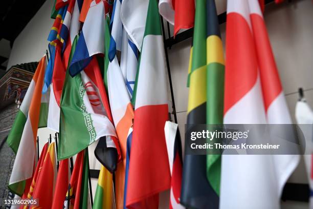 The flag of Iran is seen among others ahead of a press conference by Rafael Grossi, Director General of the IAEA, about the agency monitoring of...