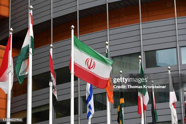 The flag of Iran is seen among others ahead of a press conference by Rafael Grossi, Director General of the IAEA, about the agency monitoring of...
