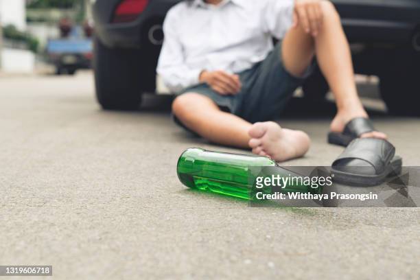 homeless alcoholism drunk man sleeping on the floor - drunk driving accident stock pictures, royalty-free photos & images