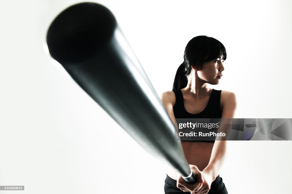 Young woman training,baseball