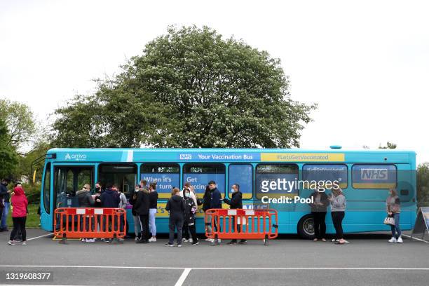 Covid-19 vaccination bus is seen outside the stadium prior to the Premier League match between Liverpool and Crystal Palace at Anfield on May 23,...
