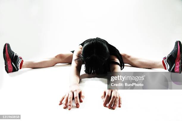 young woman training,stretch - legs apart stock pictures, royalty-free photos & images