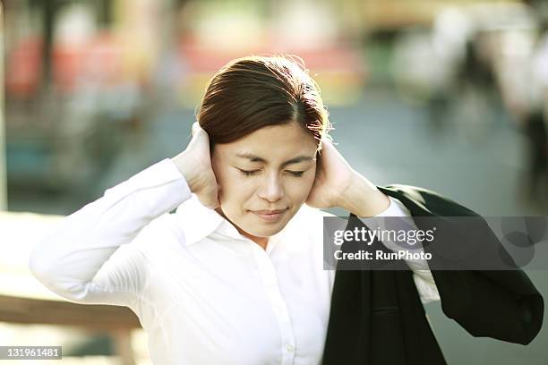 businesswoman have closed her ears - hands covering ears stock pictures, royalty-free photos & images