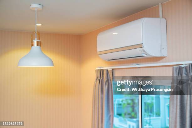 air conditioner on wall background - ac unit stock pictures, royalty-free photos & images