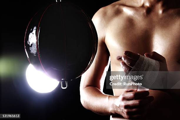 young man training,boxing - punching ball stock pictures, royalty-free photos & images