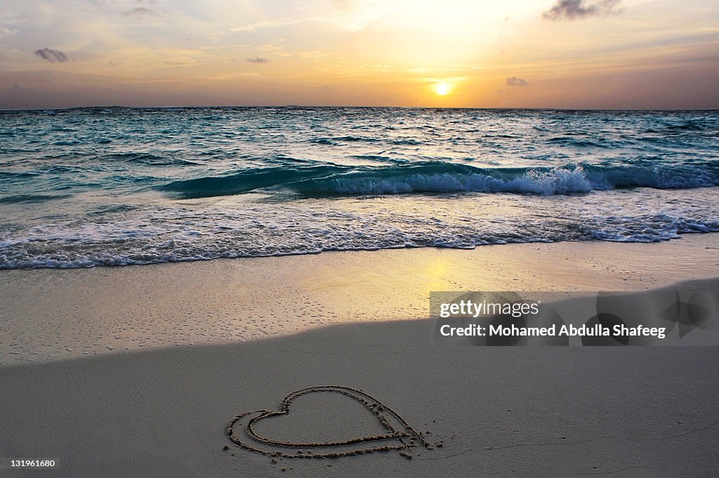 Heart drawn on sand