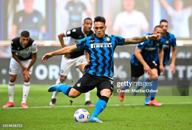 Lautaro Martinez of FC Internazionale scores their side's third goal from the penalty spot during the Serie A match between FC Internazionale Milano...