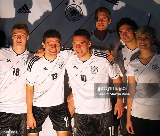 Toni Kroos, Thomas Mueller, Lukas Podolski, Per Mertesacker and Mats Hummels pose with the Jersey during the Germany national team Euro 2012 jersey...