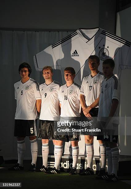 Players model shirts during the German national team Euro 2012 jersey launch at the Mercedes Benz center on November 9, 2011 in Hamburg, Germany.