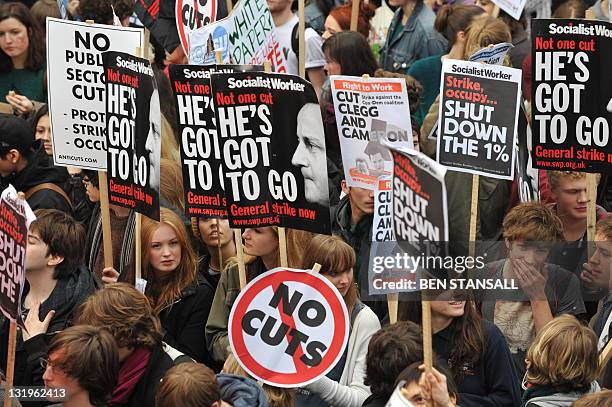Student demonstrators carry banners as they march against cuts in tuition funding in London on November 9, 2011. Thousands of students headed to...