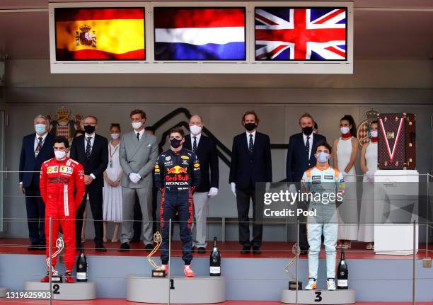 Second placed Carlos Sainz of Spain and Ferrari, race winner Max Verstappen of Netherlands and Red Bull Racing and third placed Lando Norris of Great...