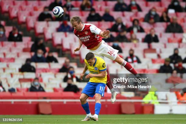 Rob Holding of Arsenal beating Leandro Trossard of Brighton & Hove Albion to the header during the Premier League match between Arsenal and Brighton...