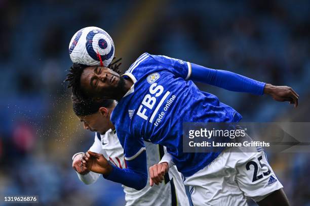 Wilfred Ndidi of Leicester City competes for a header with Dele Alli of Tottenham Hotspur during the Premier League match between Leicester City and...