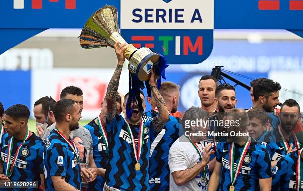 Matias Vecino of FC Internazionale lifts the Serie A trophy as his team mates celebrate after the Serie A match between FC Internazionale Milano and...