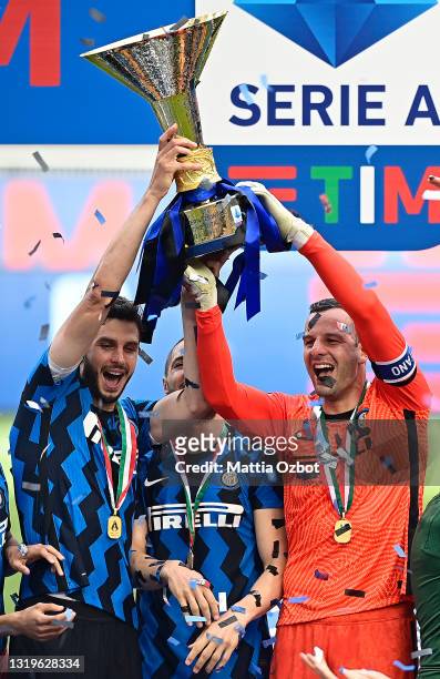 Andrea Ranocchia and Samir Handanovic of FC Internazionale celebrate with the Serie A trophy during the Serie A match between FC Internazionale...