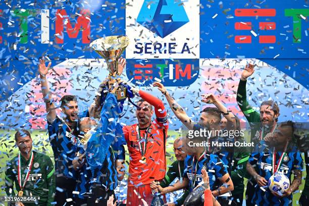 Romelu Lukaku and Samir Handanovic of FC Internazionale celebrates with the Serie A trophy whilst team mates celebrate after the Serie A match...