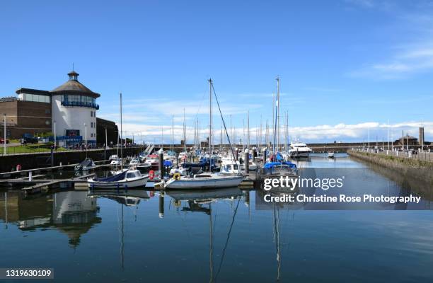 blue sky blue sea's and boats - whitehaven cumbria stock-fotos und bilder