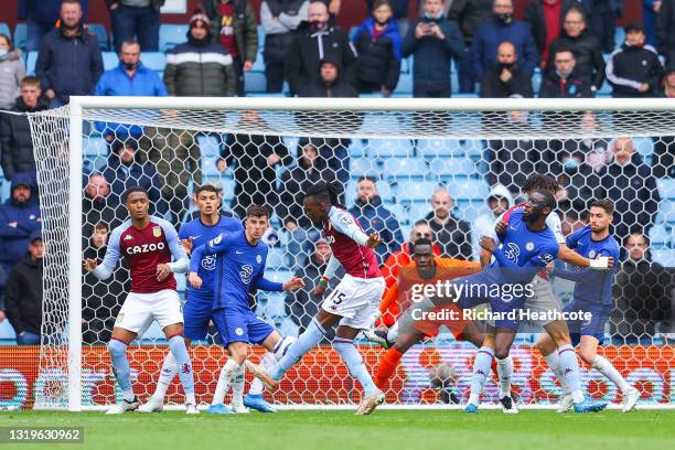 Bertrand Traore of Aston Villa scores their side's first goal past Edouard Mendy of Chelsea during the Premier League match between Aston Villa and...