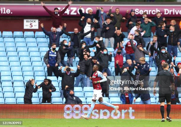 Bertrand Traore of Aston Villa celebrates after scoring their side's first goal during the Premier League match between Aston Villa and Chelsea at...