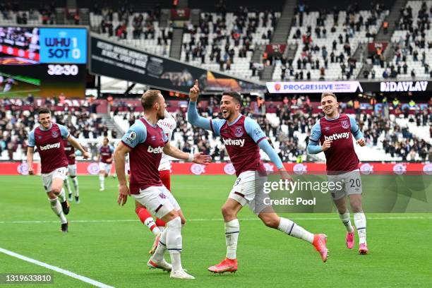 Pablo Fornalso of West Ham celebrates with teammates after scoring their second goal during the Premier League match between West Ham United and...