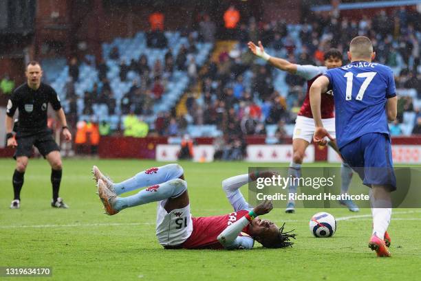 Bertrand Traore of Aston Villa is challenged by Mateo Kovacic of Chelsea leading to a penalty being awarded during the Premier League match between...