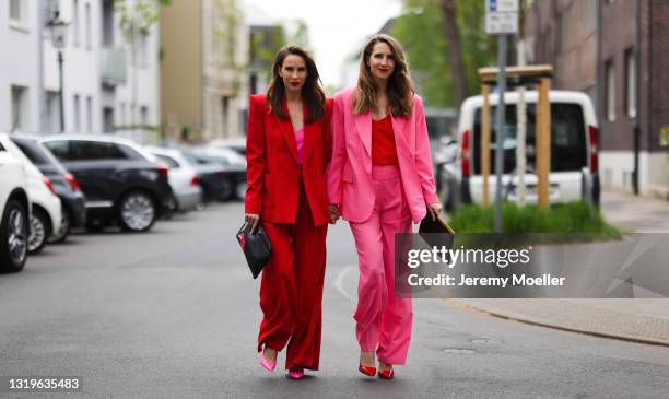 Alexandra Lapp wearing red Aggi blazer and trousers, pink Jadicted silk V neck top, pink Balenciaga heels, red Celine cat-eye sunglasses in red and...