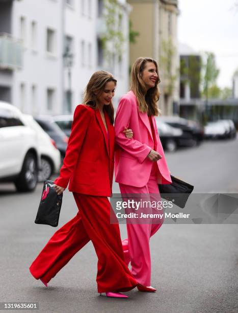 Alexandra Lapp wearing red Aggi blazer and trousers, pink Jadicted silk V neck top, pink Balenciaga heels, red Celine cat-eye sunglasses in red and...