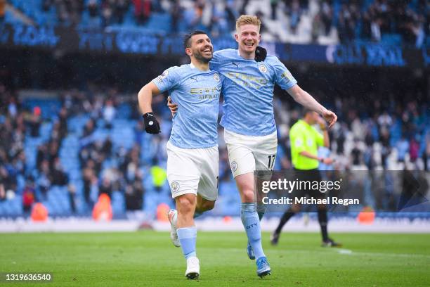 Sergio Aguero of Manchester City celebrates with teammate Kevin De Bruyne after scoring his team's fourth goal during the Premier League match...