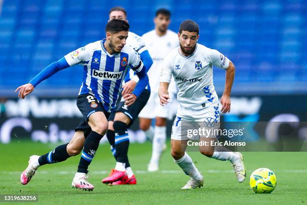 Oscar Gil of RCD Espanyol challenges for the ball against Samuel Shashoua of CD Tenerife during the Liga Smartbank match betwen RCD Espanyol de...