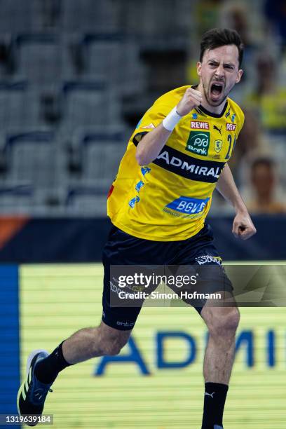 Patrick Groetzki of Rhein-Neckar Loewen celebrates during the EHF European League Finals third-place playoff match at SAP Arena on May 23, 2021 in...