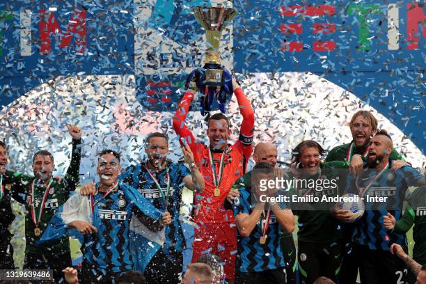 Players of FC Internazionale celebrate the trophy for the victory of nineteenth "scudetto" at the end of the last Serie A match between FC...