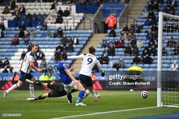 Gareth Bale of Tottenham Hotspur scores his team's fourth goal past Kasper Schmeichel of Leicester City during the Premier League match between...