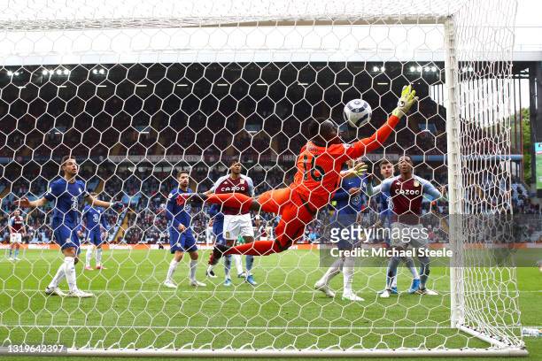 Edouard Mendy of Chelsea fails to save from Bertrand Traore of Aston Villa as he scores his side's first goal during the Premier League match between...