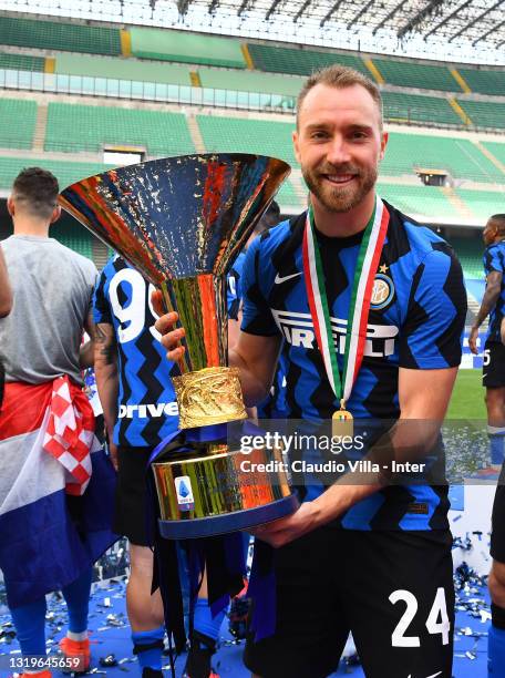 Christian Eriksen of FC Internazionale poses with the trophy for the victory of "scudetto" at the end of the last Serie A match between FC...