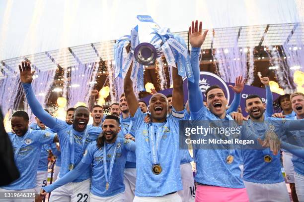 Fernandinho of Manchester City lifts the Premier League Trophy, as Manchester City are presented with the Trophy as they win the league following the...