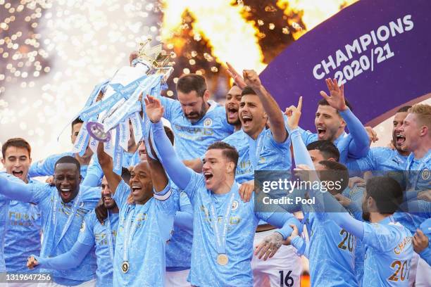 Fernandinho of Manchester City lifts the Premier League Trophy, as Manchester City are presented with the Trophy as they win the league following the...