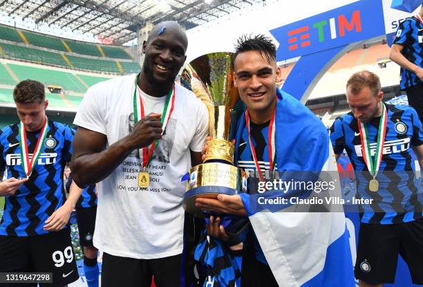 Romelu Lukaku and Lautaro Martinez of FC Internazionale pose with the trophy for the victory of "scudetto" at the end of the last Serie A match...