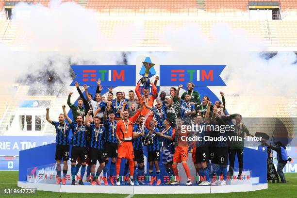 Players and staff of FC Internazionale celebrate withthe trophy for the victory of nineteenth "scudetto" at the end of the last Serie A match between...